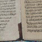 قرآن خطی با شجره نامه و قید تاریخ در کتاب